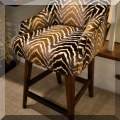 F52. Vanguard zebra print upholstered swivel stool. 